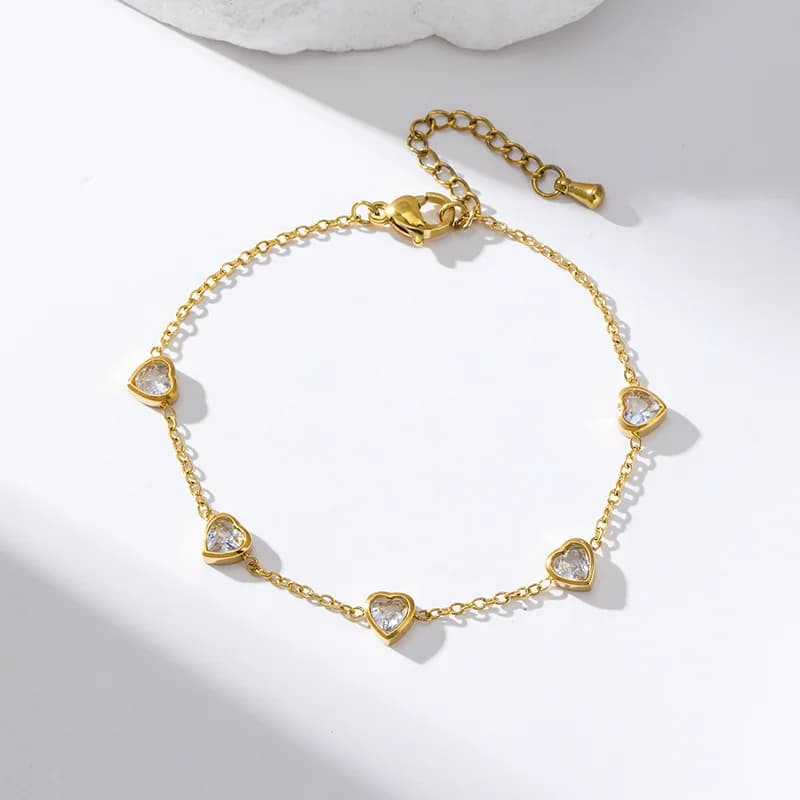 Blomsterblad charms armbånd, guldfarvet