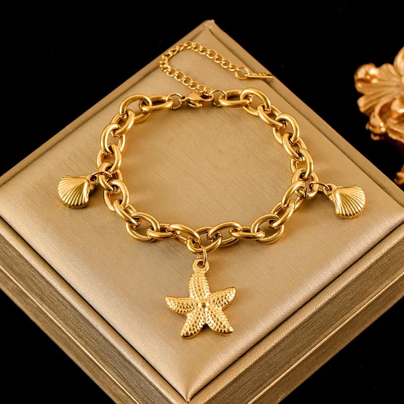 Armbånd med søstjerne- og skaldyr charms i rustfrit stål