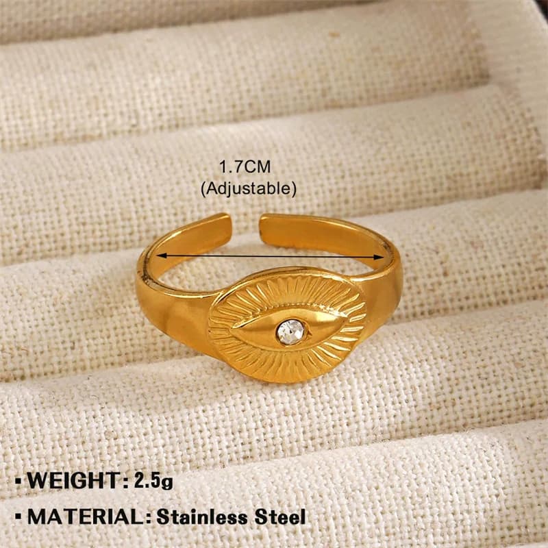 Gyldent øje med zirkonia-charm statement ring