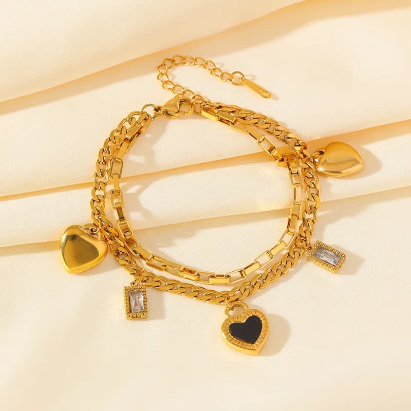 Vendbart hjertevedhæng armbånd, forgylt
