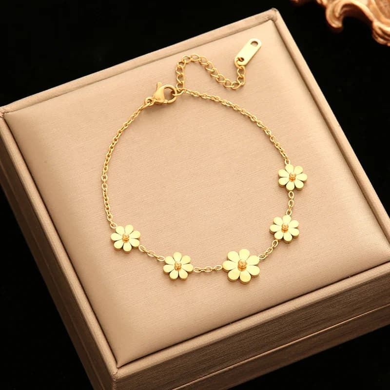 Blomsterblad charms armbånd, guldfarvet
