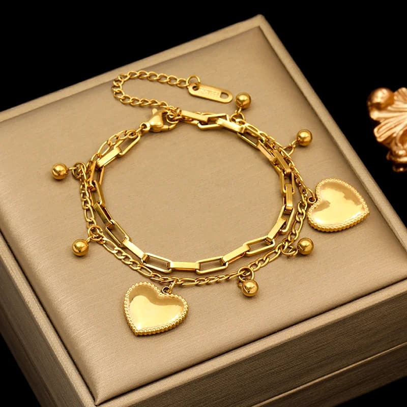 Vendbart hjertevedhæng armbånd, forgylt