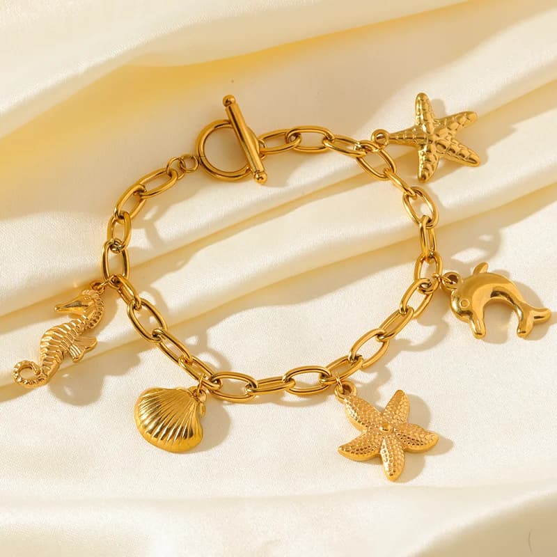 Armbånd med søstjerne- og skaldyr charms i rustfrit stål