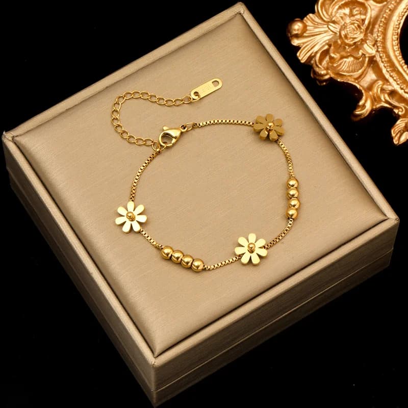 Blomsterblad charms armbånd, guldfarvet