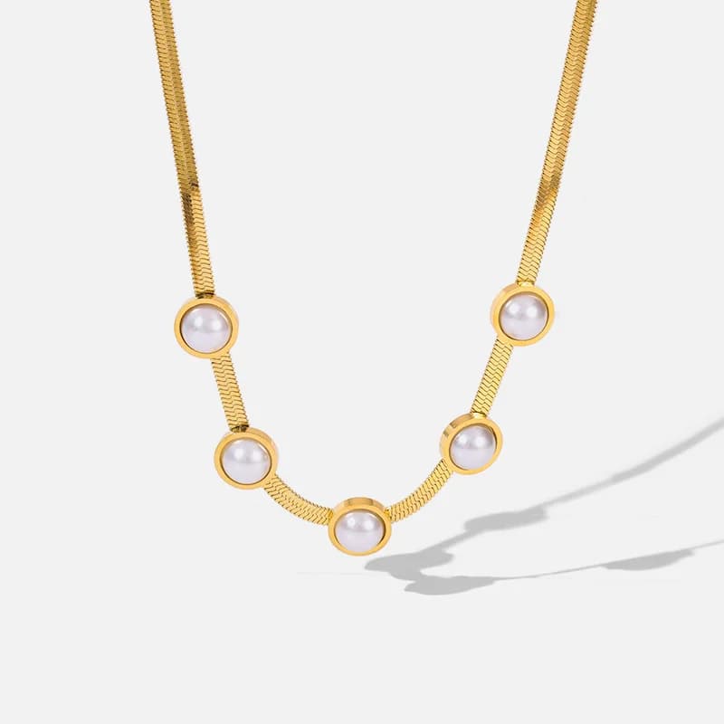 Gylden choker med rund perle