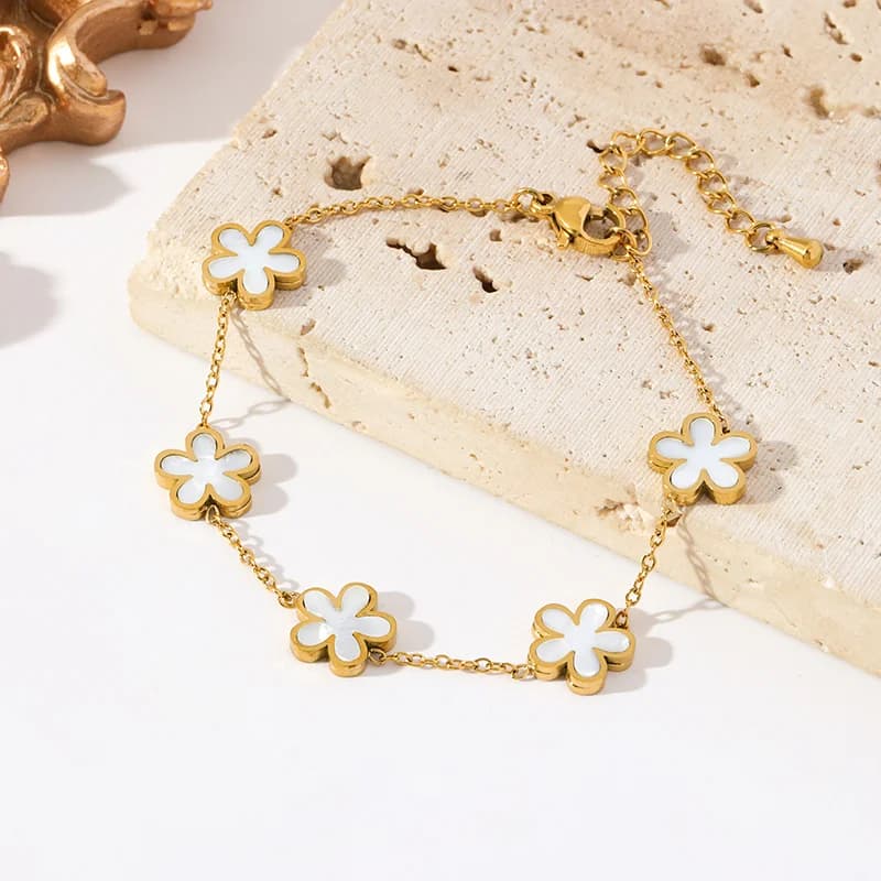 Blomsterblad charms armbånd, guldfarvet